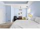 Comfortable bedroom with large window, warm lighting, and cozy reading nook at 1452 Redwine Rd, Fayetteville, GA 30215