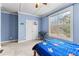 Bedroom with a bed, an electric piano, and two closets under a textured ceiling at 1452 Redwine Rd, Fayetteville, GA 30215