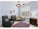 Relaxing bedroom setting with reading nook, large window, and cozy lighting at 1452 Redwine Rd, Fayetteville, GA 30215