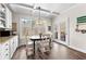 Bright dining area features a modern light fixture and a view of the private deck at 1452 Redwine Rd, Fayetteville, GA 30215