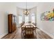 Formal dining room with chandelier, a large wood table, and arched windows at 1452 Redwine Rd, Fayetteville, GA 30215