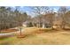 Home with a sprawling yard featuring meticulous landscaping and a private driveway at 1452 Redwine Rd, Fayetteville, GA 30215