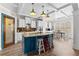 Spacious kitchen features a large island with seating, stylish cabinets, and modern appliances at 1452 Redwine Rd, Fayetteville, GA 30215