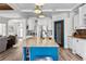 Spacious kitchen features a large island with seating, stylish cabinets, and modern appliances at 1452 Redwine Rd, Fayetteville, GA 30215