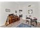 Bright living room with wood floors, drum kit, piano, and view into the living room at 1452 Redwine Rd, Fayetteville, GA 30215