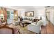 Inviting living room with hardwood floors, a fireplace, and natural light, offering a cozy retreat at 170 Elysian Nw Way, Atlanta, GA 30327