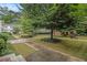 Apartment courtyard with walkways, mature trees, lush lawns, and inviting green spaces for relaxation and enjoyment at 2230 Cheshire Bridge Ne Rd # 401, Atlanta, GA 30324