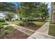 Manicured courtyard with inviting walkways, mature trees, and garden beds enhances the exterior of these apartment buildings at 2230 Cheshire Bridge Ne Rd # 401, Atlanta, GA 30324