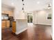 Inviting living room with hardwood flooring that connects to the kitchen and balcony at 2230 Cheshire Bridge Ne Rd # 401, Atlanta, GA 30324