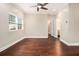 Spacious room with hardwood floors, ceiling fan, natural light, and access to a bathroom at 2230 Cheshire Bridge Ne Rd # 401, Atlanta, GA 30324