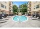 Community pool featuring lounge chairs and landscaped surroundings between apartment buildings on a sunny day at 2230 Cheshire Bridge Ne Rd # 401, Atlanta, GA 30324