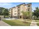Exterior view of a lovely apartment building with a refreshing community pool and well-maintained landscaping at 2230 Cheshire Bridge Ne Rd # 401, Atlanta, GA 30324