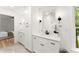 Bathroom features dual sink vanity with white cabinets and black hardware, plus a view into the main bedroom at 2855 Lamer Trce, Marietta, GA 30066