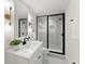 A bathroom featuring a sleek glass-enclosed shower and modern vanity at 2855 Lamer Trce, Marietta, GA 30066