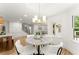 Cozy breakfast nook with modern light fixture adjacent to the kitchen and stairway at 2855 Lamer Trce, Marietta, GA 30066