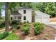 Beautiful two-story home with white siding, stone accents, three-car garage, and mature landscaping at 2855 Lamer Trce, Marietta, GA 30066