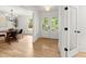 Inviting foyer with hardwood floors, french doors, and view into the dining room at 2855 Lamer Trce, Marietta, GA 30066