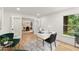 Bright home office with glass french doors, stylish desk, and view to dining room at 2855 Lamer Trce, Marietta, GA 30066