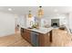 Open-concept kitchen featuring a large island with sink and stainless appliances at 2855 Lamer Trce, Marietta, GA 30066