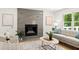 Bright living room features a striking fireplace, hardwood floors, and neutral decor at 2855 Lamer Trce, Marietta, GA 30066