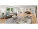 Spacious open-concept living area with hardwood floors and view into the kitchen at 2855 Lamer Trce, Marietta, GA 30066