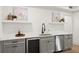 The wet bar has gray cabinets and white countertops at 2855 Lamer Trce, Marietta, GA 30066