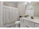 Clean bathroom featuring a vanity with white cabinets, a mirror, and a shower with white curtain at 1850 Cotillion Drive # 2118, Dunwoody, GA 30338