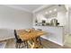 Bright dining area featuring a modern table and chairs next to a kitchen with stainless steel appliances at 1850 Cotillion Drive # 2118, Dunwoody, GA 30338