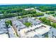 Aerial view of a luxury condominium building next to a parking deck and busy thoroughfare at 1850 Cotillion Drive # 2118, Dunwoody, GA 30338