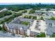 Aerial view of a luxury condominium building next to a parking deck in a commercial neighborhood at 1850 Cotillion Drive # 2118, Dunwoody, GA 30338