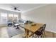 Open floor plan living and dining area with hardwood floors and large windows for natural light at 1850 Cotillion Drive # 2118, Dunwoody, GA 30338