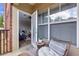 Cozy patio with wicker furniture and view into the well-lit living room at 1850 Cotillion Drive # 2118, Dunwoody, GA 30338