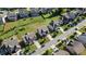 Aerial view of the neighborhood showcasing well-maintained homes and lush landscaping at 2050 Poplar Ridge Pl, Cumming, GA 30040