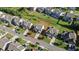 Aerial view of a home in a neighborhood with manicured lawns and mature trees at 2050 Poplar Ridge Pl, Cumming, GA 30040
