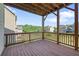 View of the back deck showcasing the wood and the surrounding trees and neighborhood at 2050 Poplar Ridge Pl, Cumming, GA 30040
