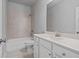 Bright bathroom features vanity with ample storage, tub with shower, and sleek, updated fixtures at 2050 Poplar Ridge Pl, Cumming, GA 30040