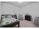 Cozy bedroom features a cheerful theme and an abundance of natural light at 2050 Poplar Ridge Pl, Cumming, GA 30040