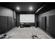 Home theater with large screen, surround sound, and comfortable seating at 2050 Poplar Ridge Pl, Cumming, GA 30040
