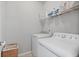 Functional laundry room with a full-sized washer and dryer with plenty of room for storage at 2050 Poplar Ridge Pl, Cumming, GA 30040
