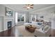 Cozy living room with fireplace, large windows, and comfortable seating at 2050 Poplar Ridge Pl, Cumming, GA 30040