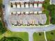 Aerial view of townhomes with lush green spaces, parking areas, and well-maintained surroundings in a desirable community at 2367 Millhaven Se St, Smyrna, GA 30080