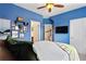 Cozy bedroom featuring a mounted tv, a closet, and a nearby staircase to an additional space in the home at 2367 Millhaven Se St, Smyrna, GA 30080