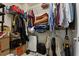 Walk-in closet featuring shelving, clothing, storage containers, and other personal items at 2367 Millhaven Se St, Smyrna, GA 30080