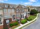 Charming townhome featuring brick accents, well-maintained landscaping, and a welcoming front entrance for a cozy curb appeal at 2367 Millhaven Se St, Smyrna, GA 30080