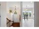 Inviting foyer view with staircase, pendant light, and glimpse of a bright breakfast nook at 2367 Millhaven Se St, Smyrna, GA 30080