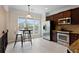 Bright kitchen features stainless steel appliances, tile backsplash, and breakfast nook with large windows at 2367 Millhaven Se St, Smyrna, GA 30080