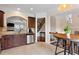 Kitchen with stainless appliances, stone countertops, and archway leading to living area at 2367 Millhaven Se St, Smyrna, GA 30080