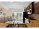 Stylish kitchen with stainless steel appliances, granite countertops, and eat-in table by the window at 2367 Millhaven Se St, Smyrna, GA 30080