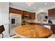 Spacious kitchen featuring stainless steel appliances, granite counters and a breakfast table near door at 2367 Millhaven Se St, Smyrna, GA 30080