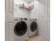 A laundry room with LG washer and dryer, plus shelving for storage, providing convenience and organization at 2367 Millhaven Se St, Smyrna, GA 30080